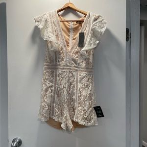 Lulu’s NWT all the attraction white lace ruffled romper